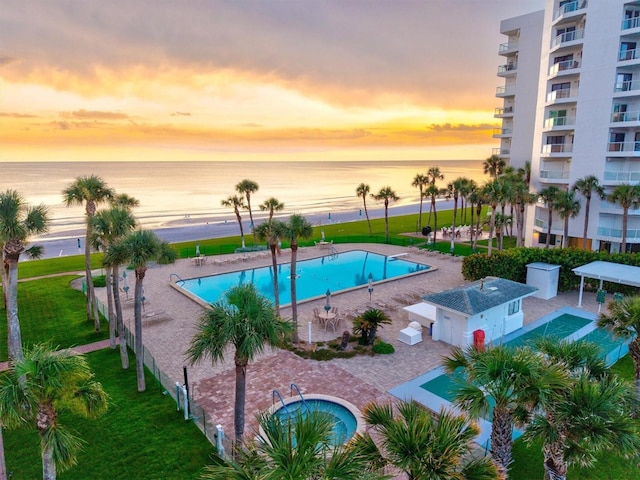 1000 Longboat Club Rd Unit 1105, Longboat Key, FL 34228 - pool at dusk with a community pool and a water view