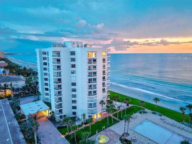 1000 Longboat Club Rd Unit 1105, Longboat Key, FL 34228 - property at dusk featuring a view of apartment building / complex and a water view