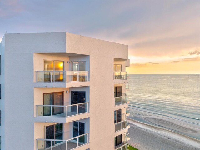 1000 Longboat Club Rd Unit 1105, Longboat Key, FL 34228 - property at dusk with a water view and a view of apartment building / complex