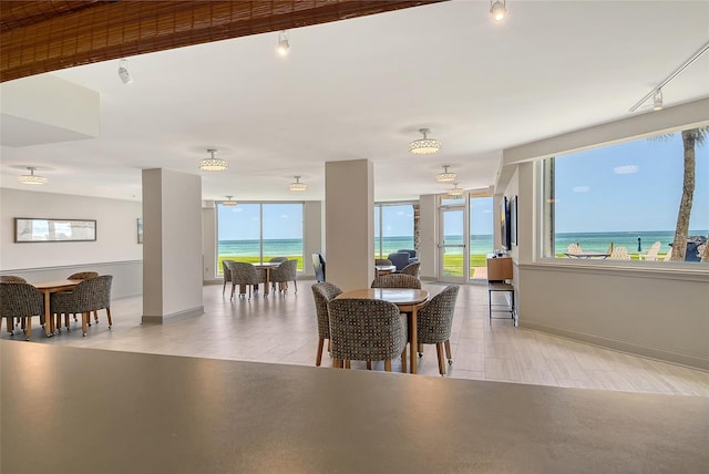 1000 Longboat Club Rd Unit 1105, Longboat Key, FL 34228 - dining area with rail lighting and a water view