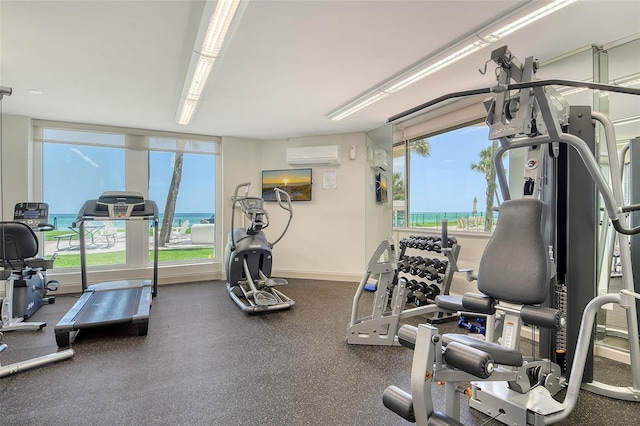 1000 Longboat Club Rd Unit 1105, Longboat Key, FL 34228 - exercise room with an AC wall unit and baseboards