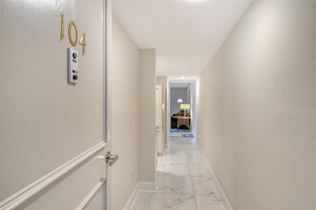 1000 Longboat Club Rd Unit 1105, Longboat Key, FL 34228 - hallway with light marble finish flooring and baseboards