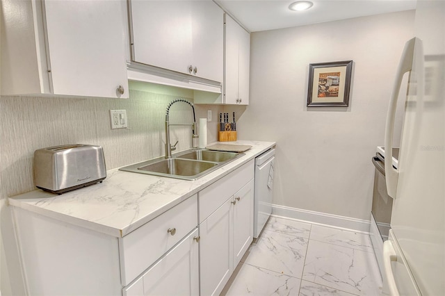 1000 Longboat Club Rd Unit 1105, Longboat Key, FL 34228 - kitchen with freestanding refrigerator, dishwasher, light marble finish flooring, white cabinetry, and light countertops