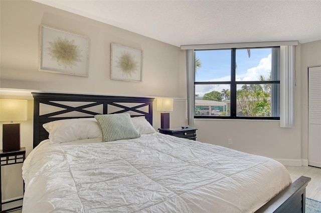 1000 Longboat Club Rd Unit 1105, Longboat Key, FL 34228 - bedroom with baseboards and wood finished floors