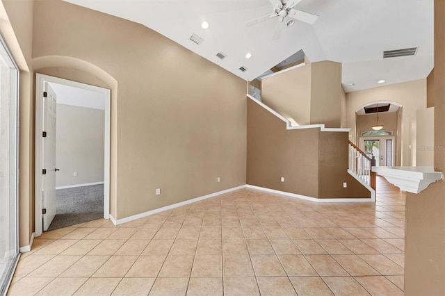 12342 Lavender Loop, Bradenton, FL 34212 - unfurnished living room with arched walkways, light tile patterned flooring, ceiling fan, stairway, and recessed lighting