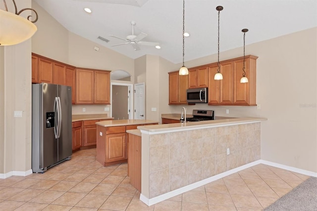 12342 Lavender Loop, Bradenton, FL 34212 - kitchen with stainless steel appliances, light tile patterned flooring, ceiling fan, light countertops, and lofted ceiling