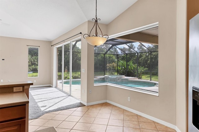 12342 Lavender Loop, Bradenton, FL 34212 - unfurnished dining area featuring vaulted ceiling and light tile patterned flooring