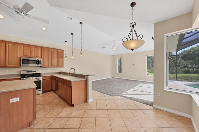 12342 Lavender Loop, Bradenton, FL 34212 - kitchen featuring stainless steel appliances, a ceiling fan, a peninsula, light countertops, and pendant lighting