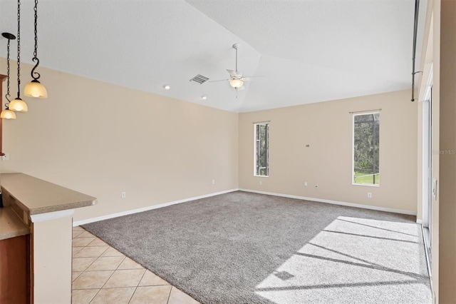 12342 Lavender Loop, Bradenton, FL 34212 - spare room with light colored carpet, a ceiling fan, vaulted ceiling, and light tile patterned floors