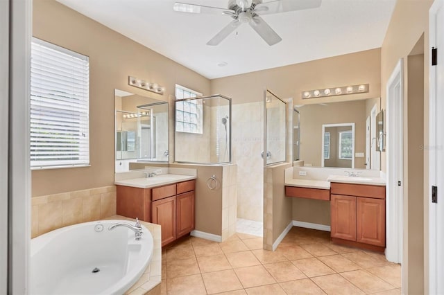 12342 Lavender Loop, Bradenton, FL 34212 - bathroom with walk in shower, a bath, two vanities, and a ceiling fan