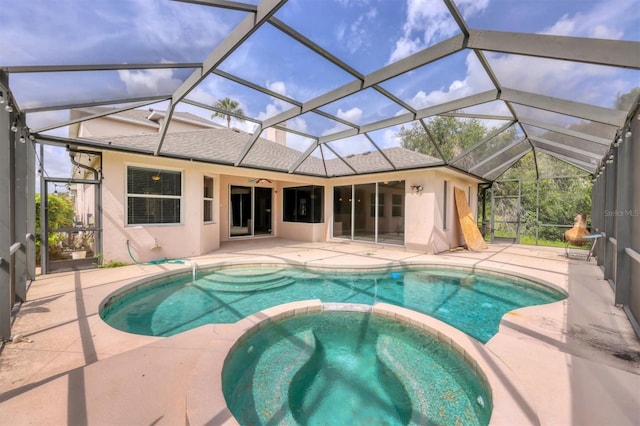 12342 Lavender Loop, Bradenton, FL 34212 - view of swimming pool with a pool with connected hot tub, a patio area, a ceiling fan, and glass enclosure
