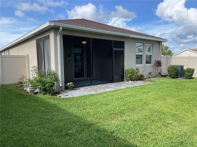 5635 Los Robles Ct, Palmetto, FL 34221 - back of property with stucco siding and a sunroom