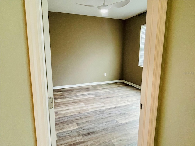 5635 Los Robles Ct, Palmetto, FL 34221 - spare room featuring wood finished floors and ceiling fan