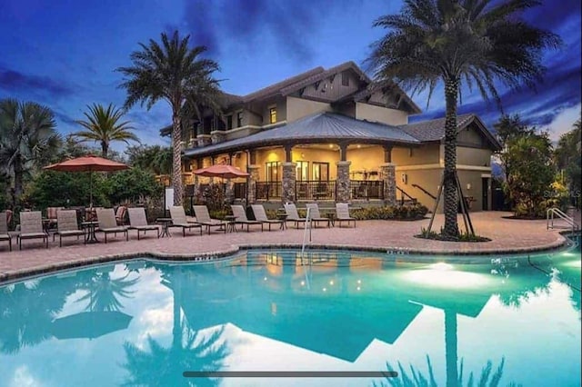 5635 Los Robles Ct, Palmetto, FL 34221 - community pool featuring a patio