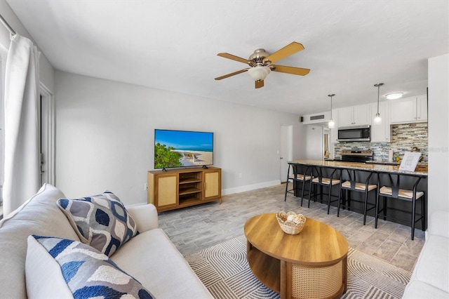 441 62nd St, Holmes Beach, FL 34217 - living area featuring light wood-style flooring and ceiling fan