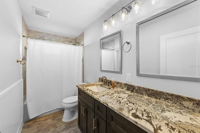 441 62nd St, Holmes Beach, FL 34217 - full bath with vanity, wood finished floors, and shower / tub combo with curtain
