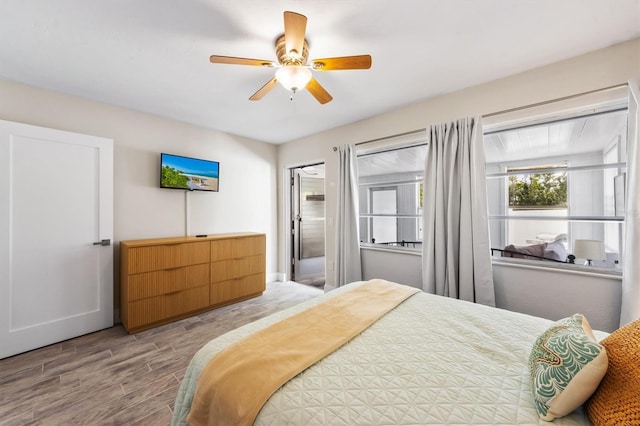 441 62nd St, Holmes Beach, FL 34217 - bedroom with wood finished floors and ceiling fan