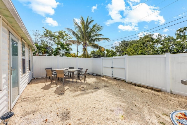 441 62nd St, Holmes Beach, FL 34217 - fenced backyard with outdoor dining space