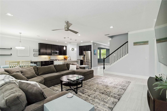 731 116th Ct NE, Bradenton, FL 34212 - living area featuring beverage cooler, a ceiling fan, stairway, recessed lighting, and ornamental molding
