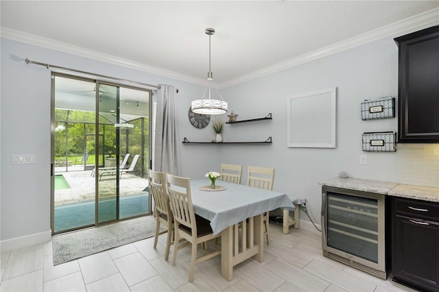 731 116th Ct NE, Bradenton, FL 34212 - dining area with beverage cooler and ornamental molding