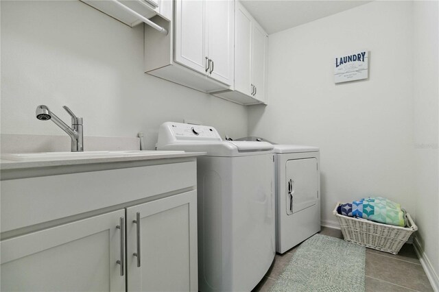 731 116th Ct NE, Bradenton, FL 34212 - washroom featuring cabinet space, washer and clothes dryer, and tile patterned floors