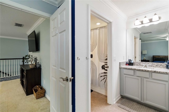 731 116th Ct NE, Bradenton, FL 34212 - bathroom with crown molding, vanity, and ensuite bath