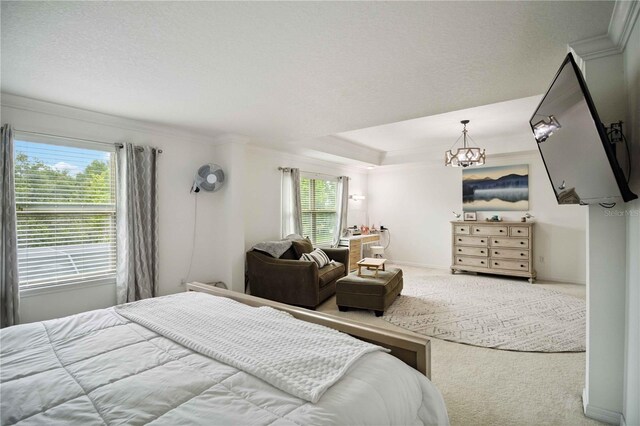 731 116th Ct NE, Bradenton, FL 34212 - bedroom with carpet, crown molding, and a chandelier