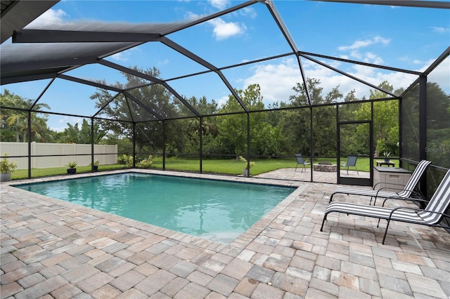 731 116th Ct NE, Bradenton, FL 34212 - swimming pool with a patio, glass enclosure, and a yard