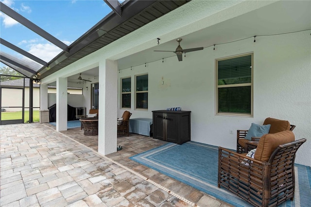 731 116th Ct NE, Bradenton, FL 34212 - view of patio with ceiling fan, glass enclosure, and an outdoor hangout area