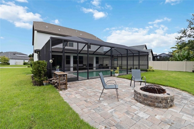 731 116th Ct NE, Bradenton, FL 34212 - rear view of house featuring a patio, a fire pit, and glass enclosure