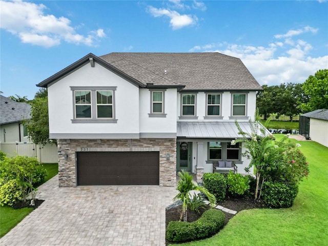 731 116th Ct NE, Bradenton, FL 34212 - view of front of property with stucco siding, covered porch, and stone siding