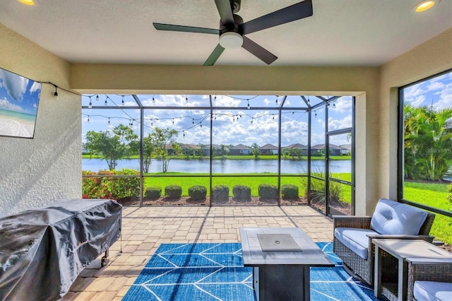 12641 Coastal Breeze Way, Bradenton, FL 34211 - sunroom / solarium featuring a water view and ceiling fan