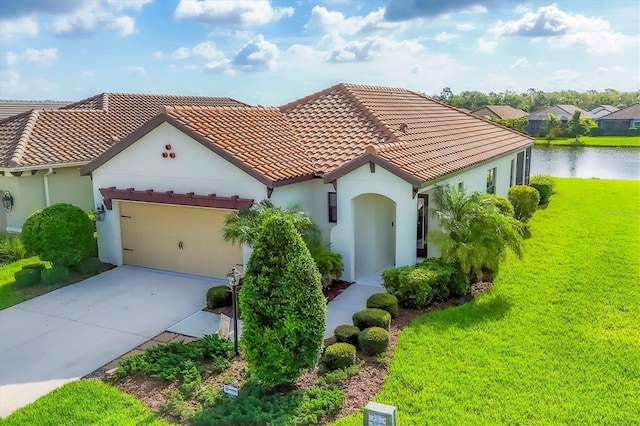 12641 Coastal Breeze Way, Bradenton, FL 34211 - mediterranean / spanish-style house featuring a garage, stucco siding, driveway, and a tile roof