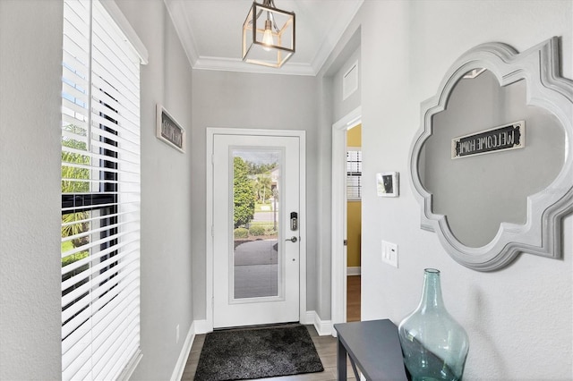12641 Coastal Breeze Way, Bradenton, FL 34211 - foyer entrance featuring wood finished floors and crown molding