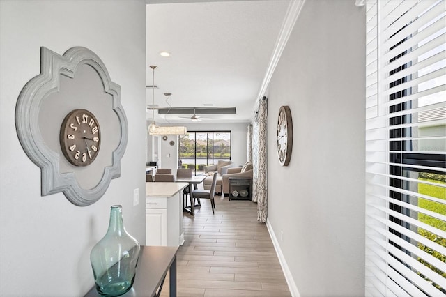 12641 Coastal Breeze Way, Bradenton, FL 34211 - hall featuring crown molding and light wood-style flooring