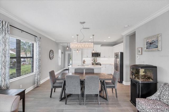 12641 Coastal Breeze Way, Bradenton, FL 34211 - dining room featuring ornamental molding, light wood-style floors, and recessed lighting