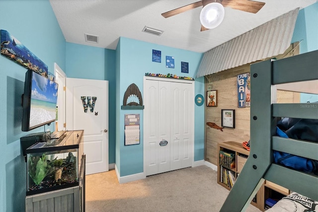 12641 Coastal Breeze Way, Bradenton, FL 34211 - carpeted bedroom with a closet and a ceiling fan