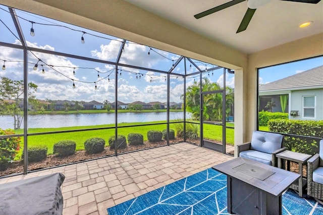 12641 Coastal Breeze Way, Bradenton, FL 34211 - sunroom / solarium with ceiling fan and a water view