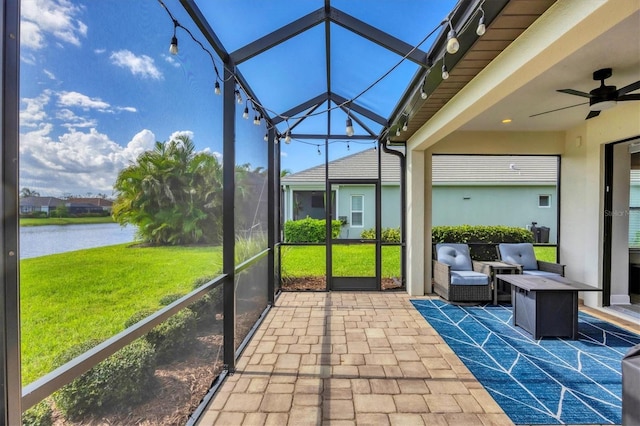 12641 Coastal Breeze Way, Bradenton, FL 34211 - sunroom with a water view and a ceiling fan