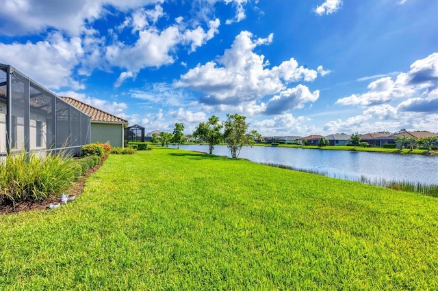 12641 Coastal Breeze Way, Bradenton, FL 34211 - view of green lawn featuring a water view and glass enclosure
