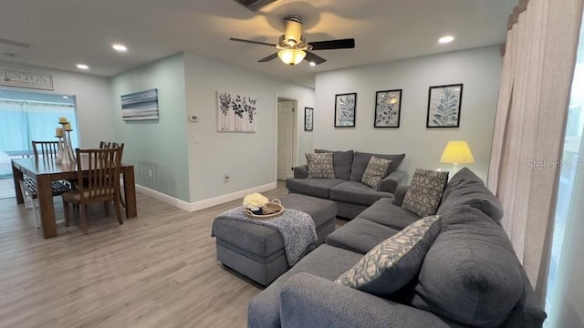 3614 29th Ave W, Bradenton, FL 34205 - living area featuring light wood finished floors, ceiling fan, and recessed lighting