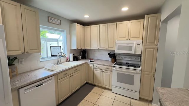 3614 29th Ave W, Bradenton, FL 34205 - kitchen featuring white appliances, backsplash, light tile patterned flooring, and recessed lighting