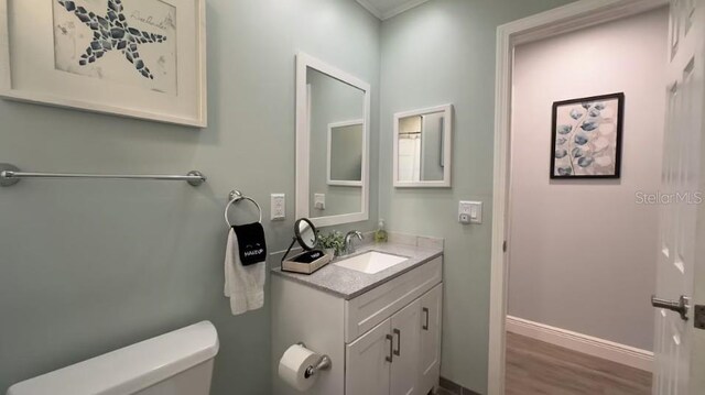 3614 29th Ave W, Bradenton, FL 34205 - bathroom with vanity, wood finished floors, and crown molding