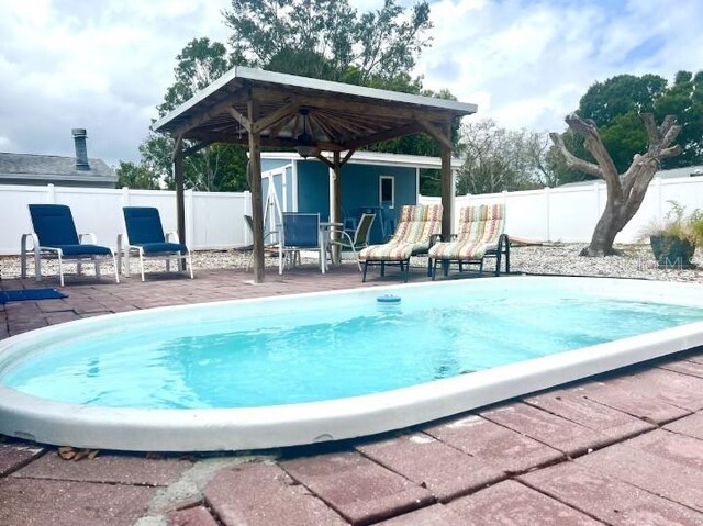 3614 29th Ave W, Bradenton, FL 34205 - view of pool with a fenced backyard, a patio area, and an outdoor structure