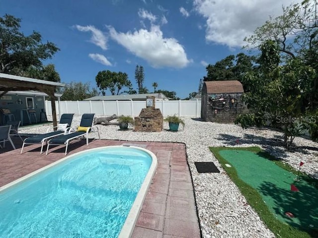 3614 29th Ave W, Bradenton, FL 34205 - view of swimming pool featuring a fenced backyard, a patio area, and an area to practice putting