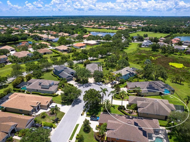280 Dahlia Ct, Bradenton, FL 34212 - aerial perspective of suburban area with a nearby body of water
