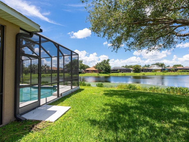 280 Dahlia Ct, Bradenton, FL 34212 - view of green lawn featuring a water view, an outdoor pool, and glass enclosure