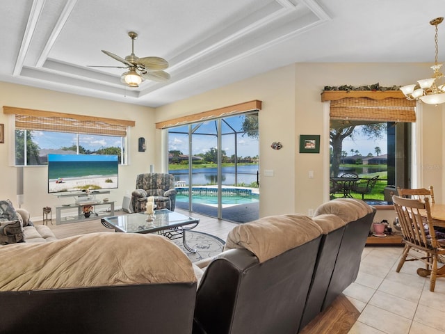 280 Dahlia Ct, Bradenton, FL 34212 - living area featuring a tray ceiling, a ceiling fan, healthy amount of natural light, and light tile patterned floors