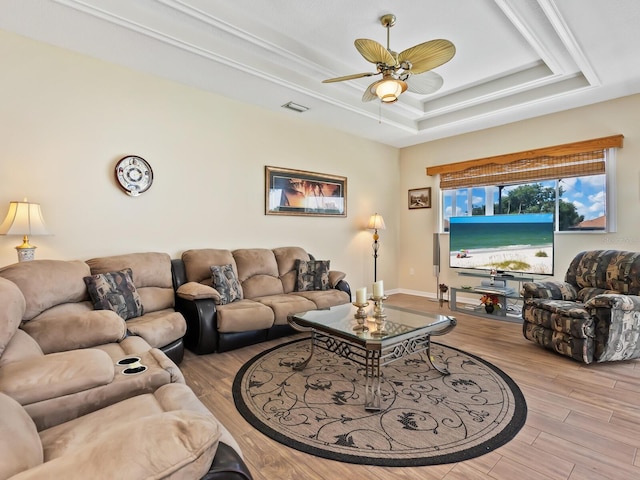 280 Dahlia Ct, Bradenton, FL 34212 - living room featuring wood finished floors, a raised ceiling, and a ceiling fan