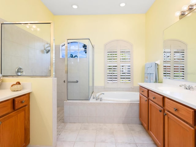 280 Dahlia Ct, Bradenton, FL 34212 - full bath with vanity, a bath, a tile shower, and tile patterned flooring